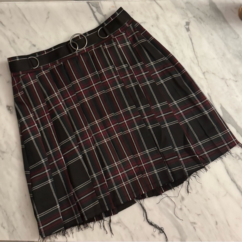 Current Mood Dolls Kill mini plaid pleated skirt frayed hem and o-ring accents